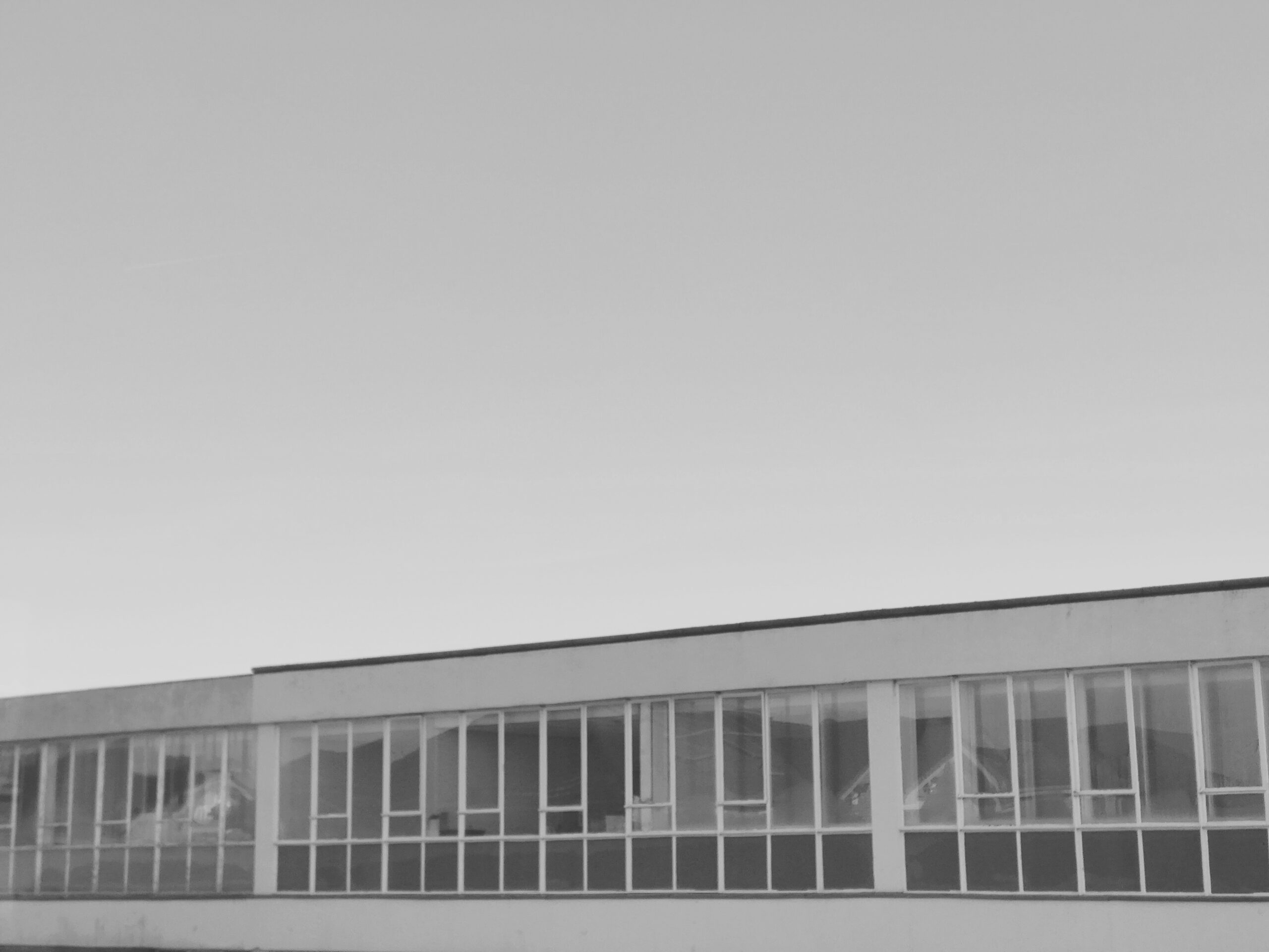 Modern building with repeating windows and empty interior spaces